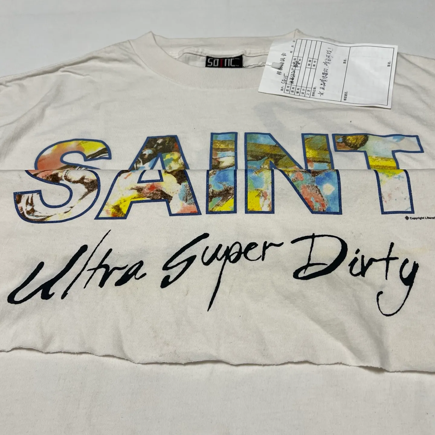 SAINT Mxxxxxx SS TEE/SUPER DIRTY/WHT oil painting SAINT SUPER DIRTY slogan TEE off-white S-XL Made of original OE yarn tube weaving without side seams to distinguish the split fabrics original consistent VINTAGE label/little angel anti-counterfeiting label top printing technology highly restored original details